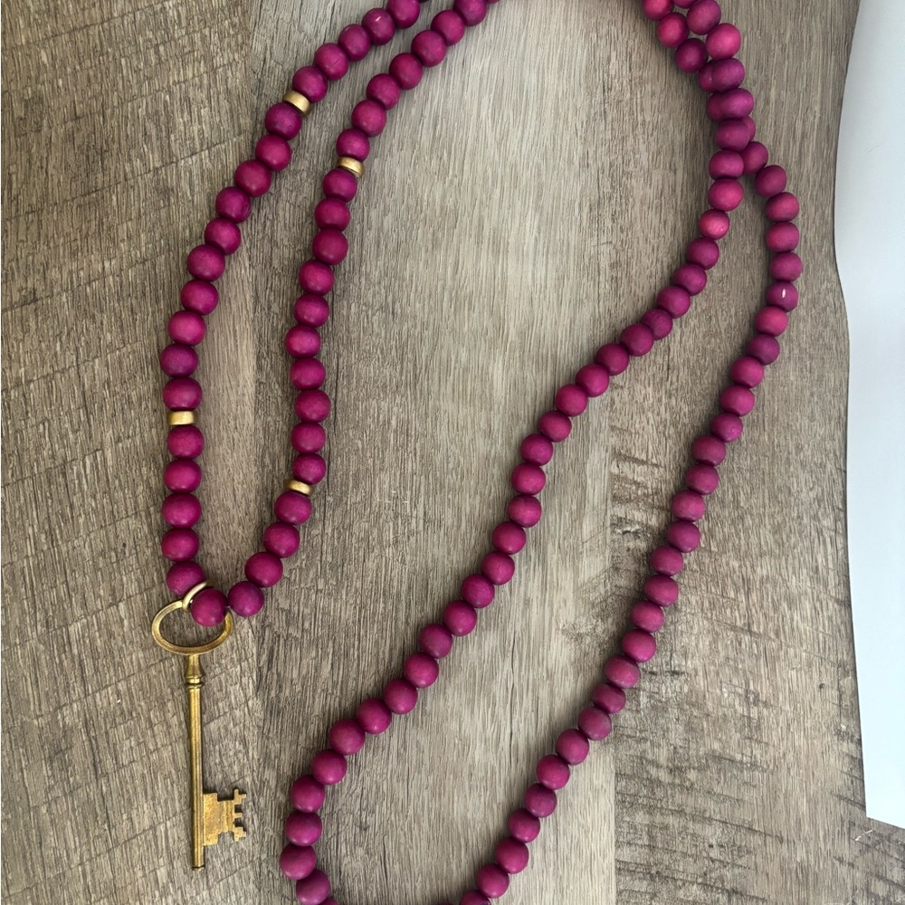 Elegant Magenta Beaded Necklace with Key Pendant